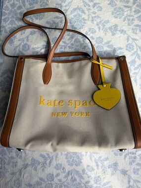 kate spade Beige Canvas Tote with Brown Trim and Yellow Logo